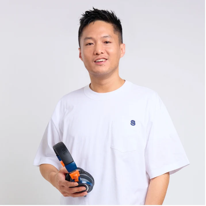 AY holding headphones